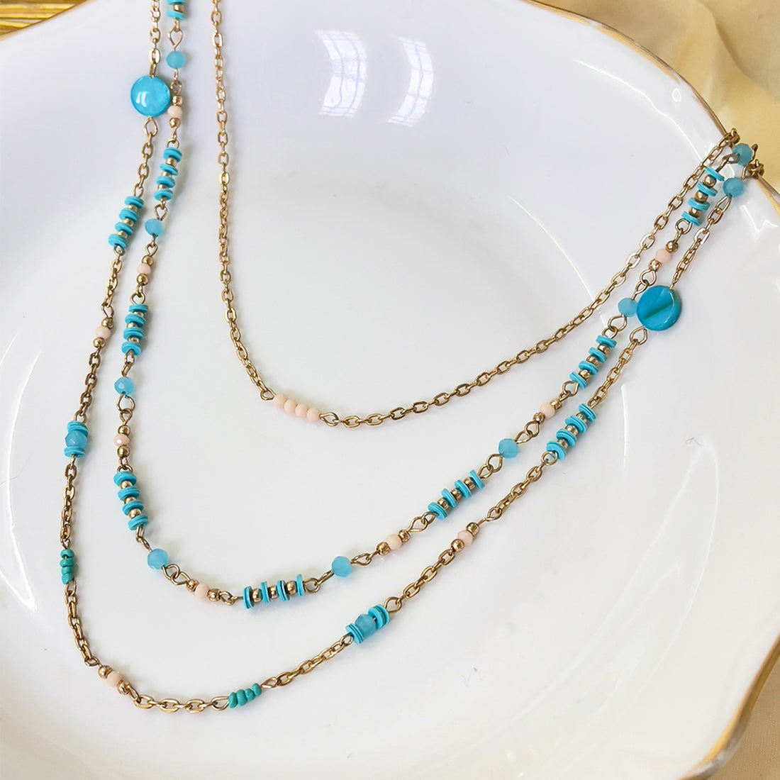 Multi-Layered hot Bead Necklace in silver tones with blue,gold,leather/brown beads